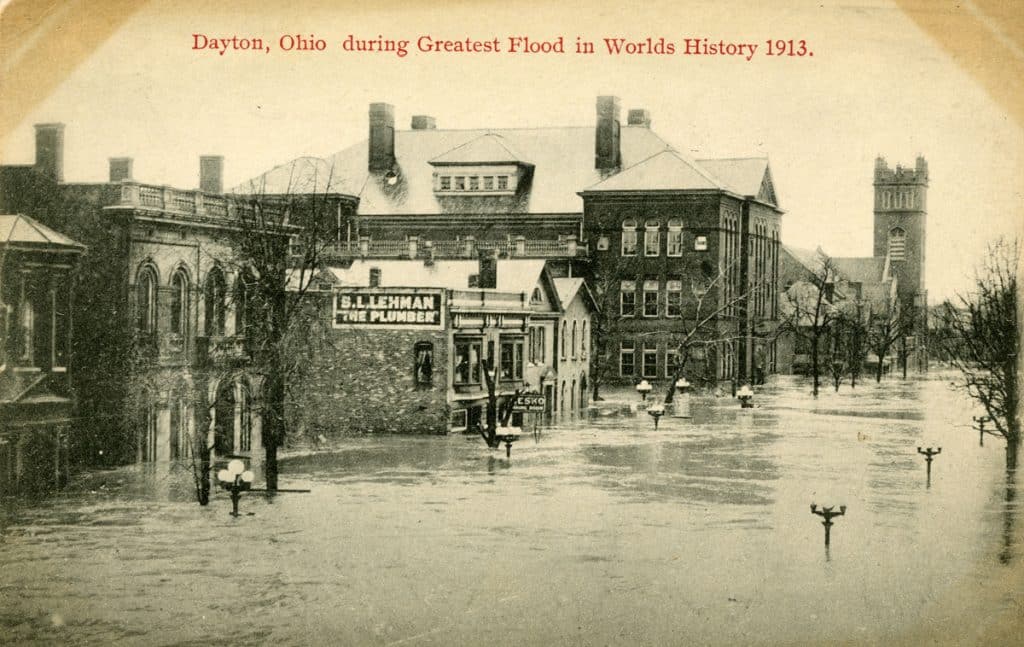 Image of Dayton during the 1913 flood where water is nearly touching the top of lamp posts